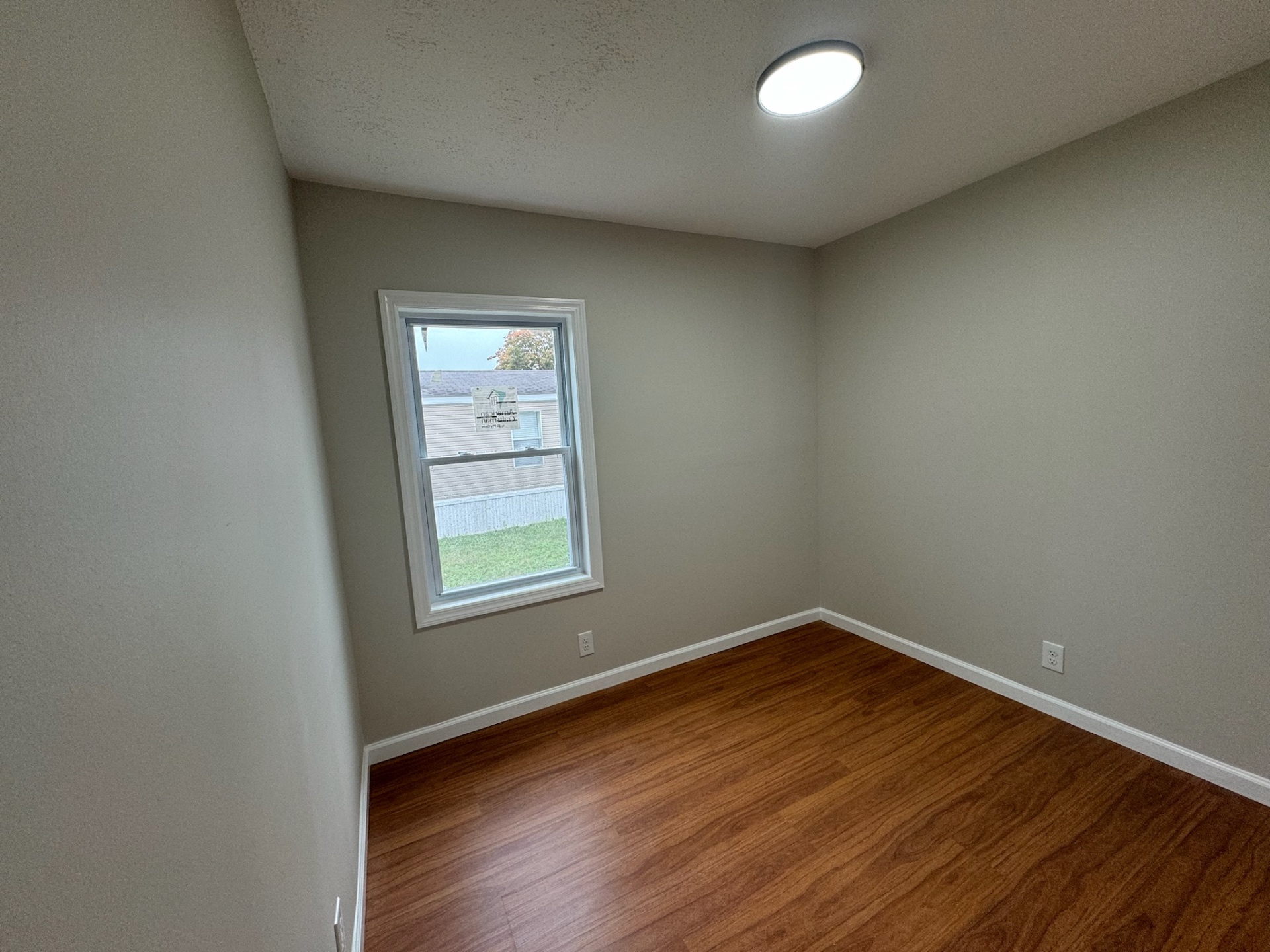 Bedroom in Jackson NJ after renovation with new floors and paint
