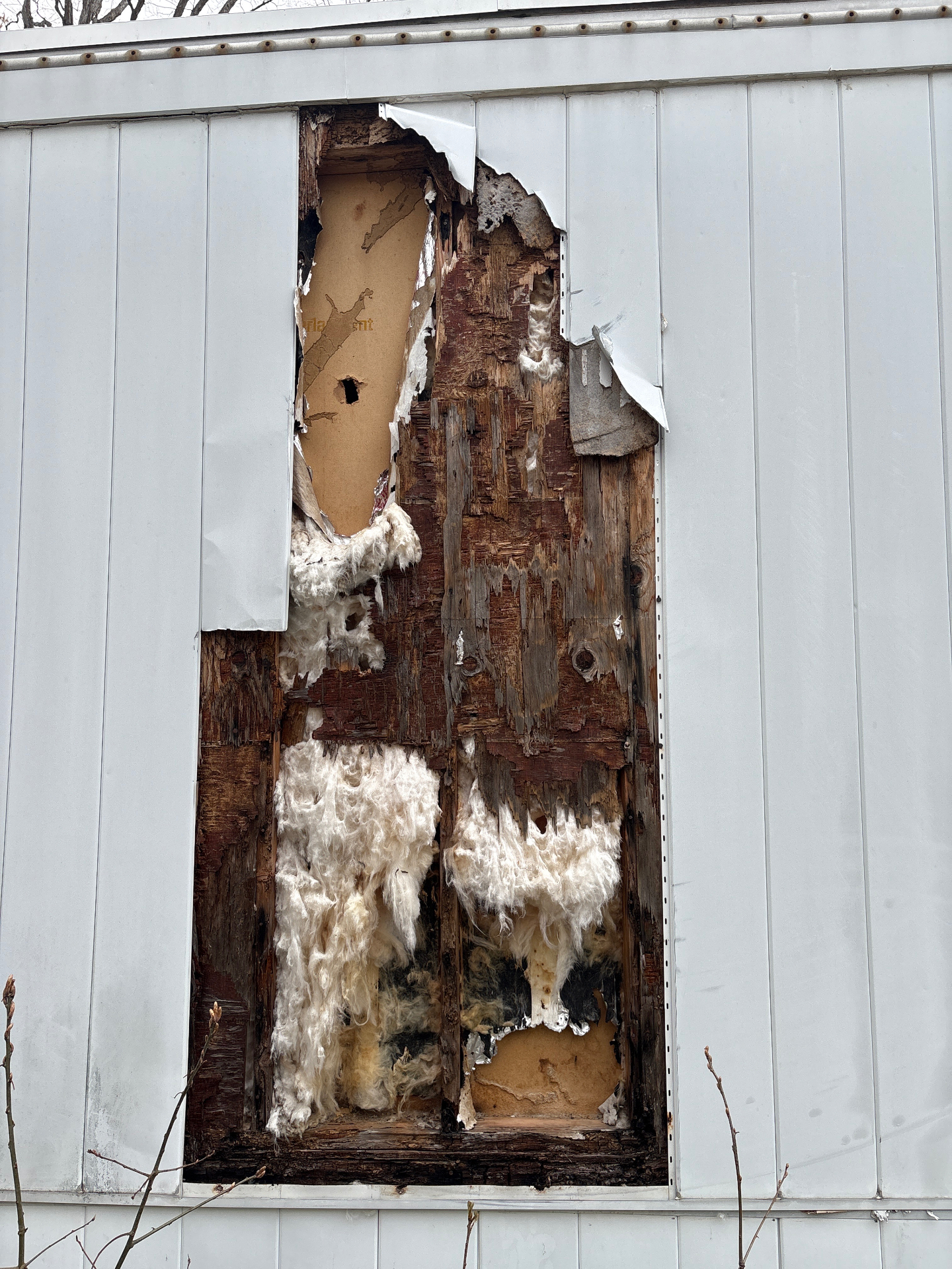 Worn exterior siding before rebuild in NJ